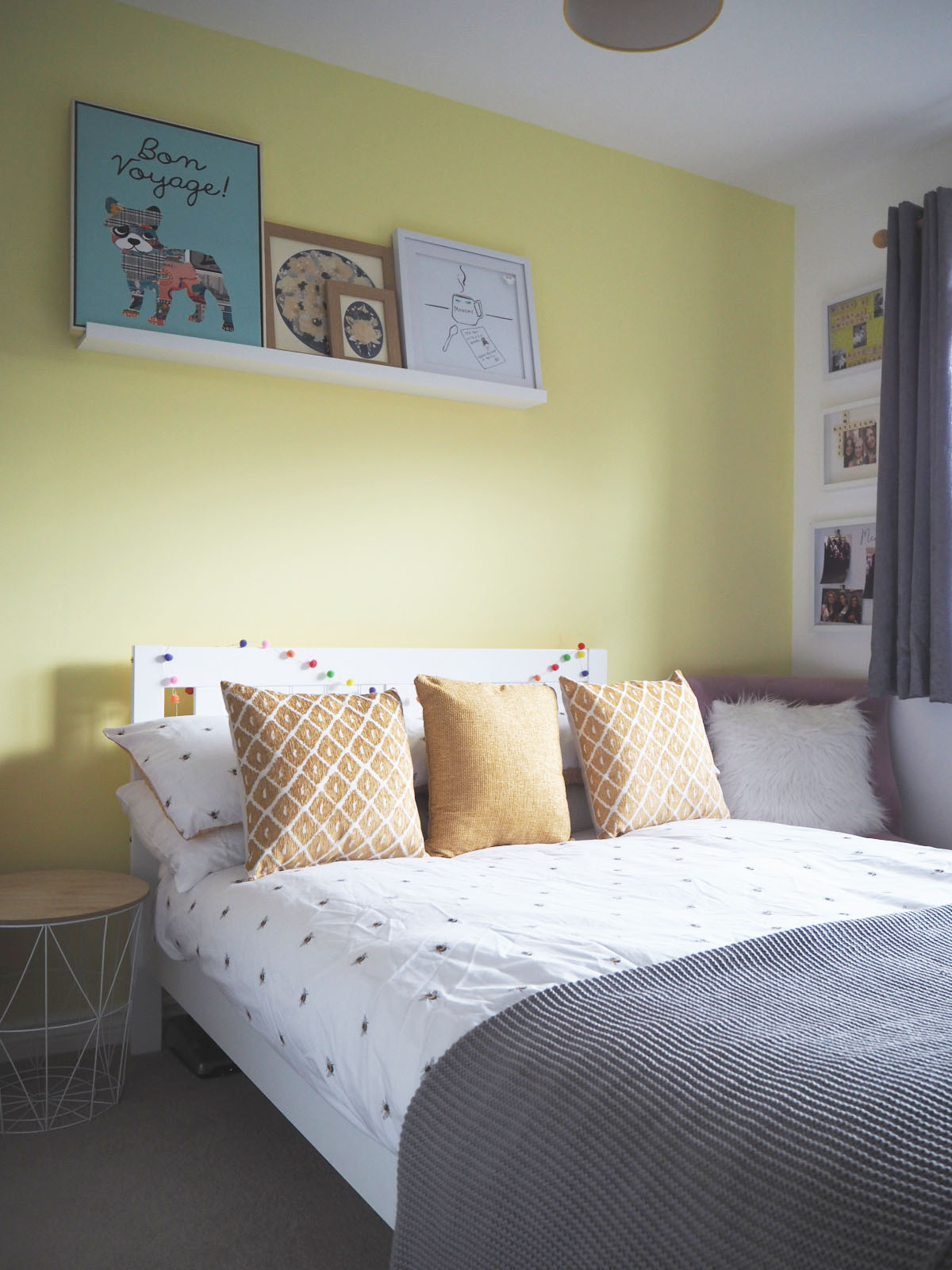 yellow themed bedding with grey, white and yellow bee-themed bedding