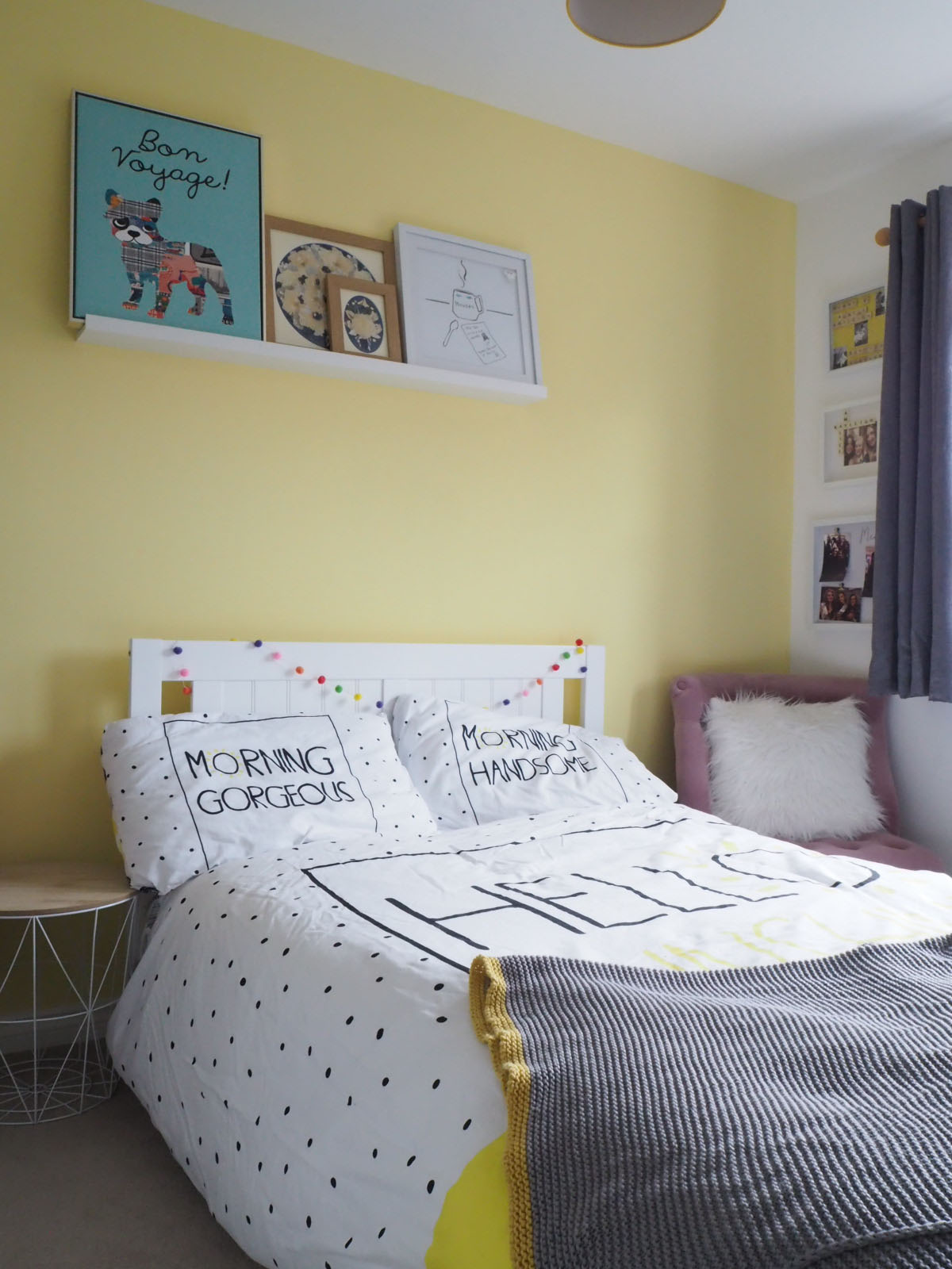 yellow bedroom with Hello themed bedding