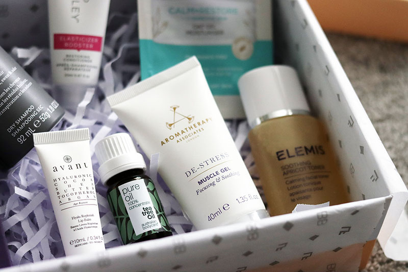 a closeup of some skincare and bodycare products packed in a box