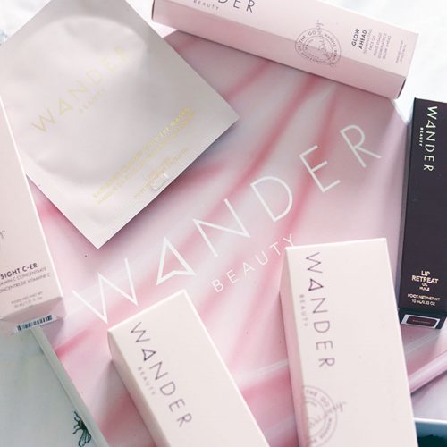 pink box reading Wander Beauty, with 7 pink beauty product boxes scattered on top