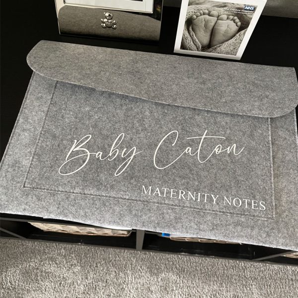 Grey felt folder with Baby Caton Maternity Notes personalised on the front.